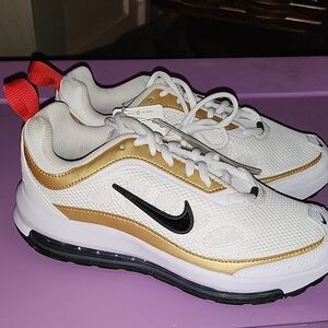 Nike White and Gold Athletic Shoes